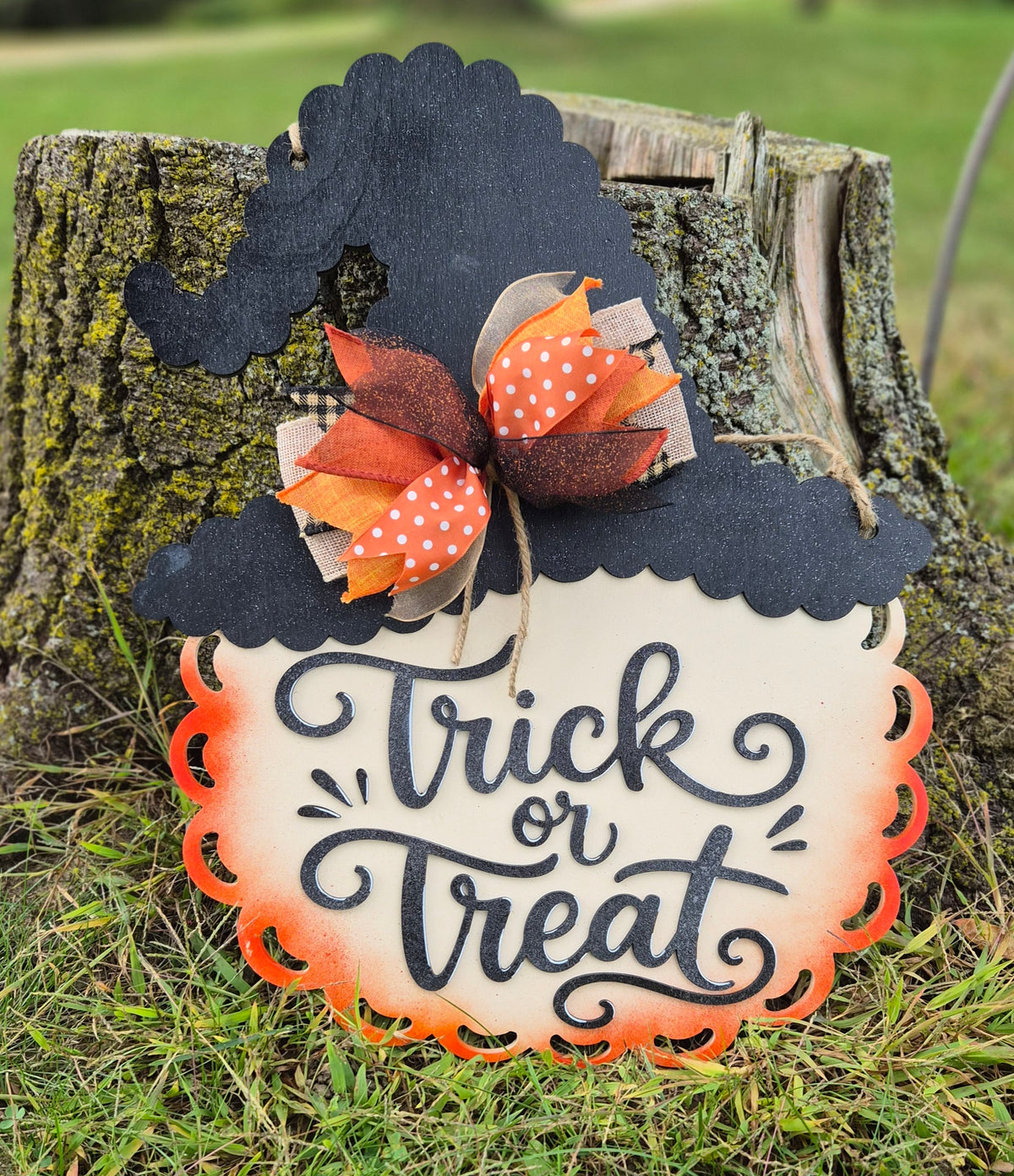 Hand-painted Trick or Treat witch hat door hanger with fall bow